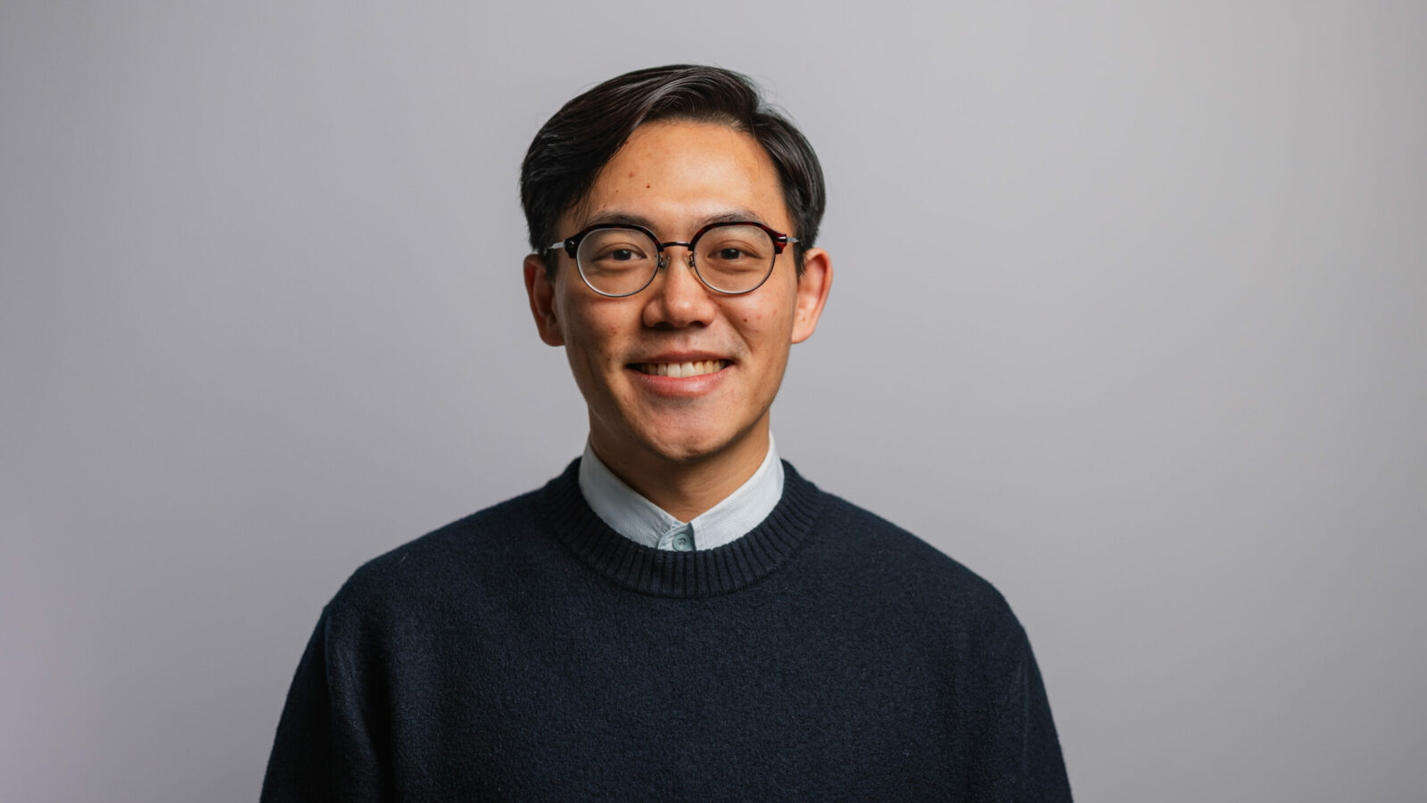 A head shot of MBA alumnus Junzhi